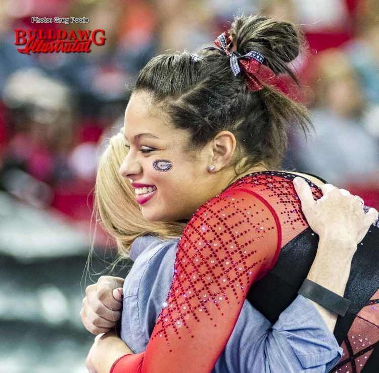 Sabrina Vega hugs coach Danna Durante