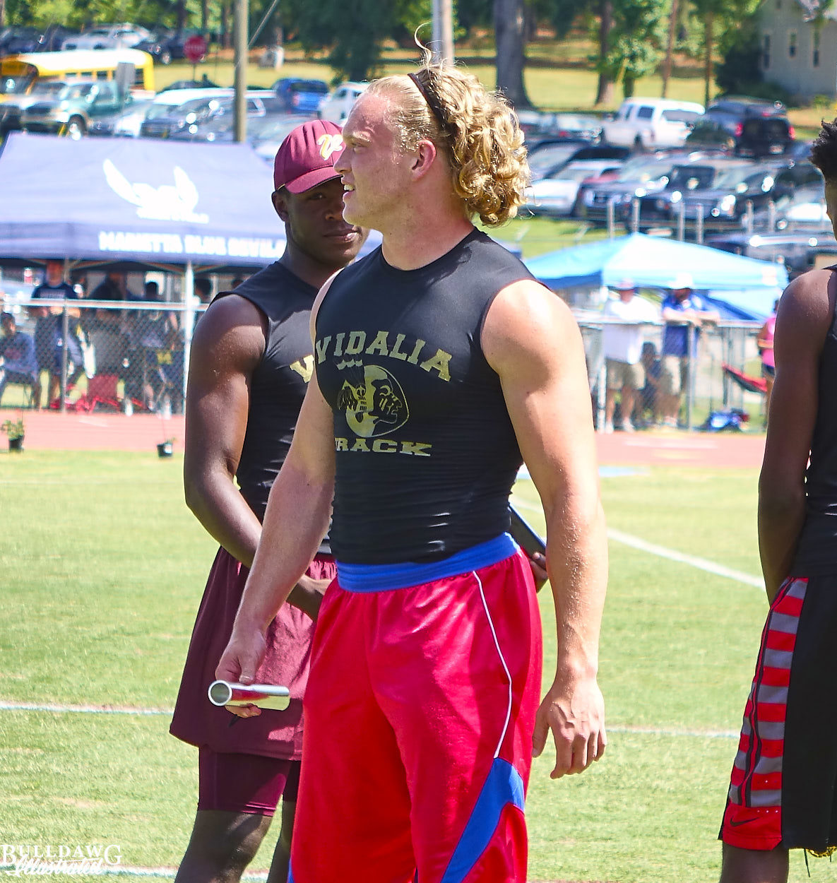 Nate McBride chats with a teammate after the 4 x 100 m relay