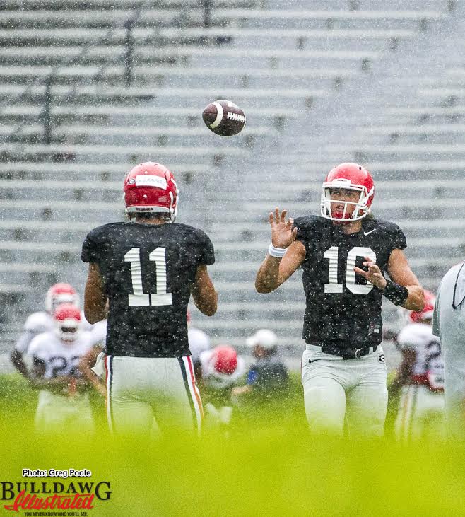 Jacob Eason(11) tossing the ball with Greyson Lambert(10)