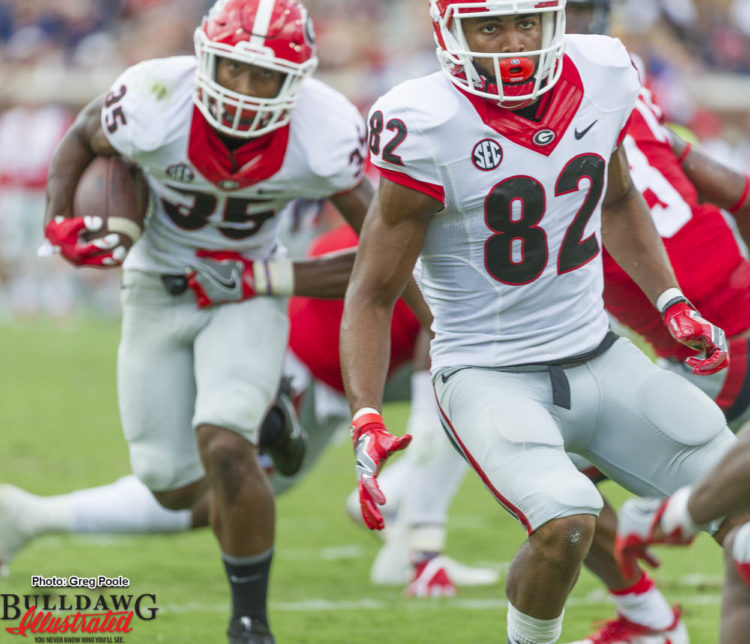 WR Michael Chigbu (82) out front blocking for RB Brian Herrien (35)