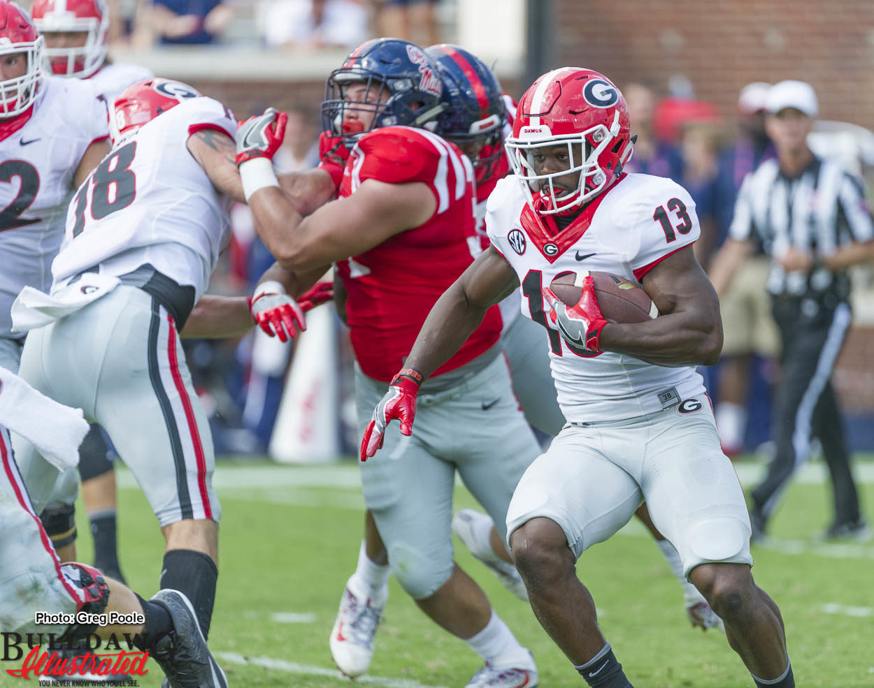 Good to see Elijah Holyfield (13) run the ball, Isaac Nauta (18) sets the edge