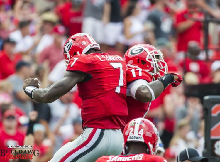 Lorenzo Carter (7) and Davin Bellamy (17)