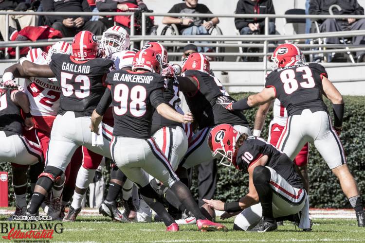 Rodrigo Blankenship (98) kicks the extra point, Jacob Eason (10) with the hold