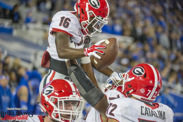 Isaiah McKenzie (16) celebrates with teammates after TD reception