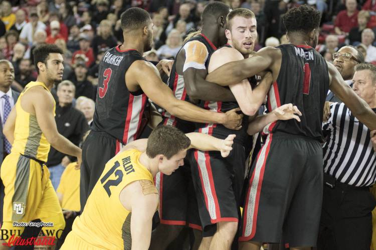 A scuffle breaks out over a loose ball
