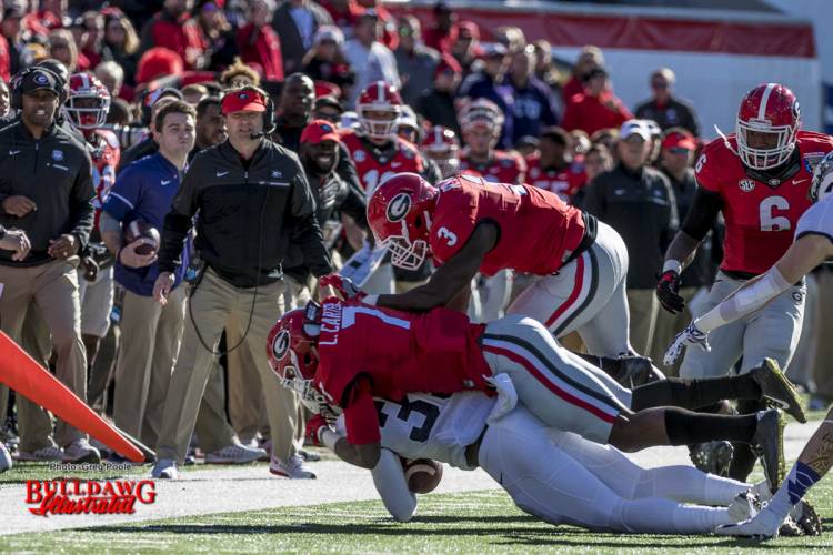 Georgia linebackers Lorenzo Carter (7) and Roquan Smith (3) say hello to a Horned Frog