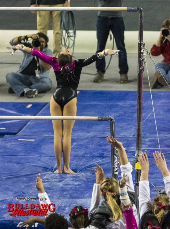 Rachel Schick sticks the landing on bars in meet against Missouri.