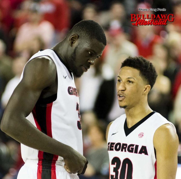 Derek Ogbeide and J.J. Frazier (30) in the closing seconds of the game