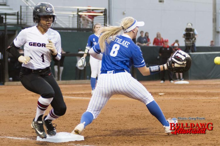 Cortni Emanuel beats the throw to first base