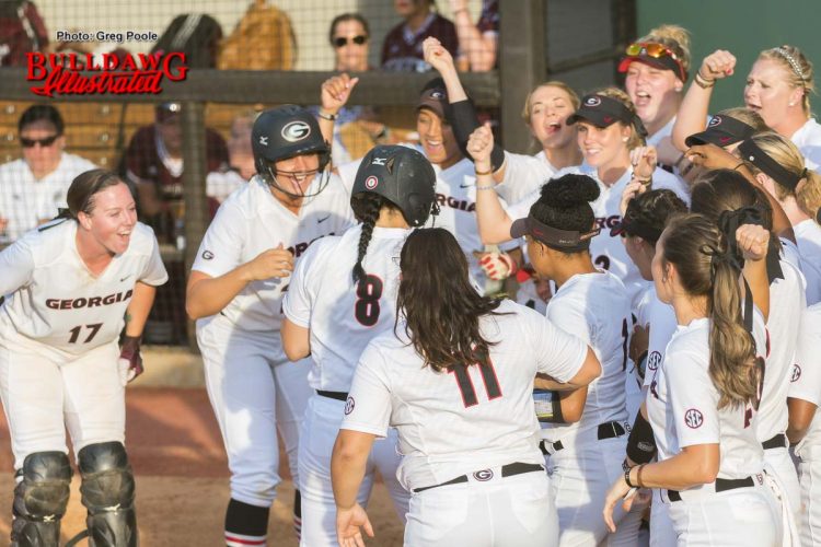Celebration at home plate for Alyssa DiCarlo's home run