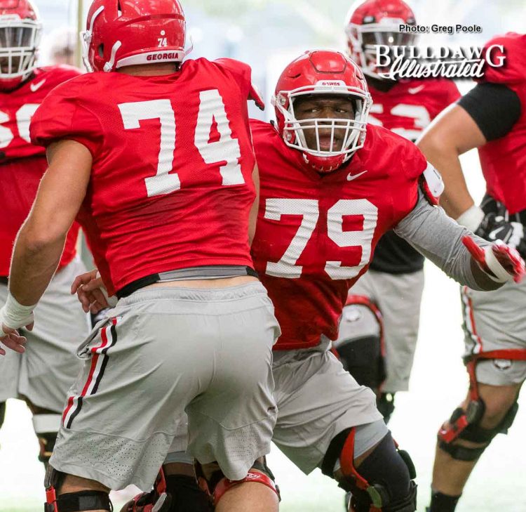 Ben Cleveland (74) and Isaiah Wilson (79) 