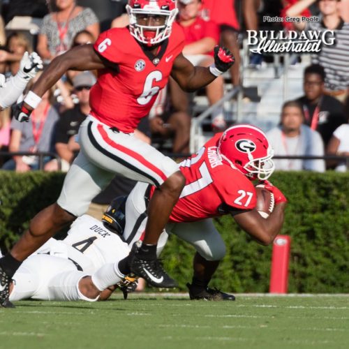 Javon Wims (6) looking for somone to block as Nick Chubb (27) is tackled by App State defender - Saturday, Sept. 2, 2017 -