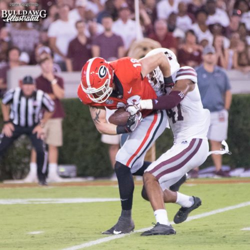 Tight end Isaac Nauta (18) drags Mississippi State safety Mark McLaurin (41) down the field into the end zone to put six on the board for Georgia. - UGA vs. Mississippi State - Saturday, Sept. 23, 2017