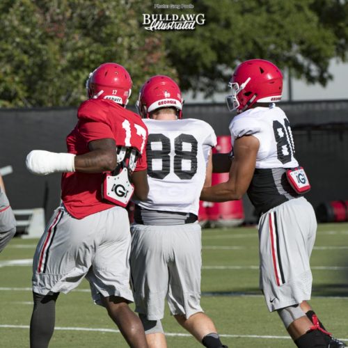 Davin Bellamy (17) with the club on his left hand in drills with Jackson Harris (88)