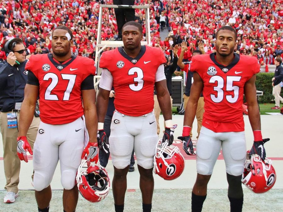 Georgia's captains for the final home game of the season versus Kentuck - Nick Chubb (17), Roquan Smith (3), and Aaron Davis (35). - Georgia 42 - Kentucky 13 - (Photo by Rob Saye)