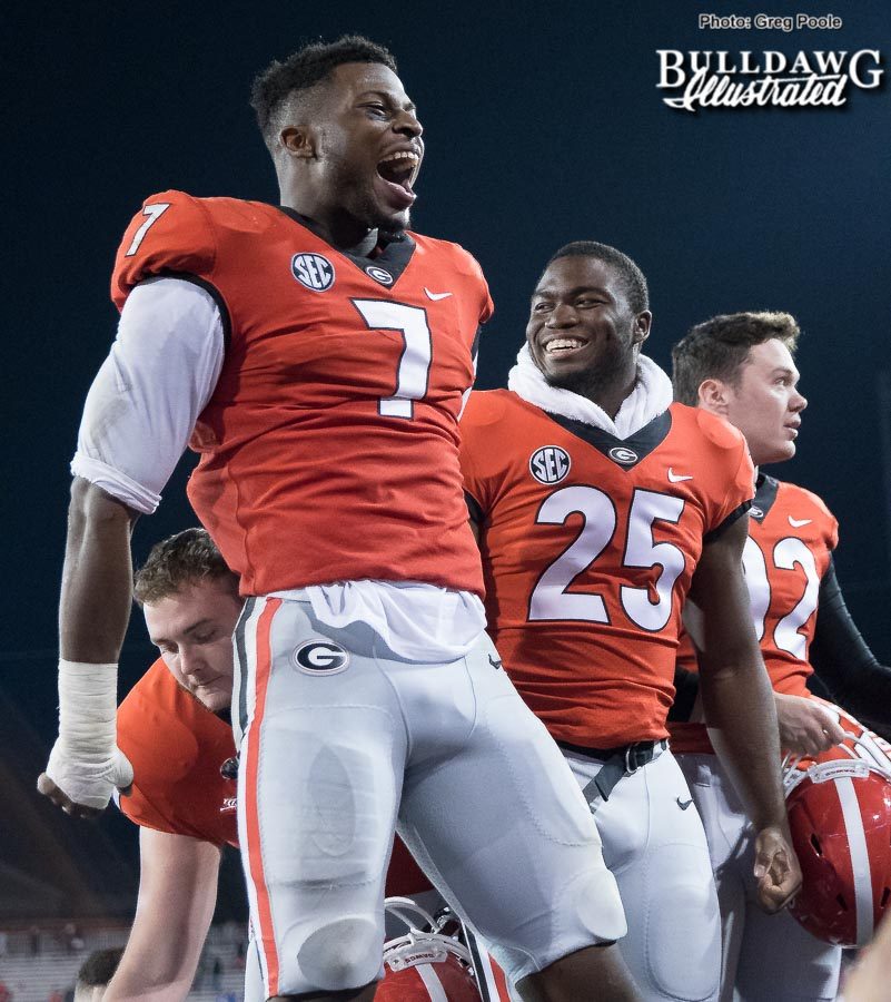 Lorenzo Carter celebrates with fans after Georgia's victory over Kentucky – Senior Day 2017