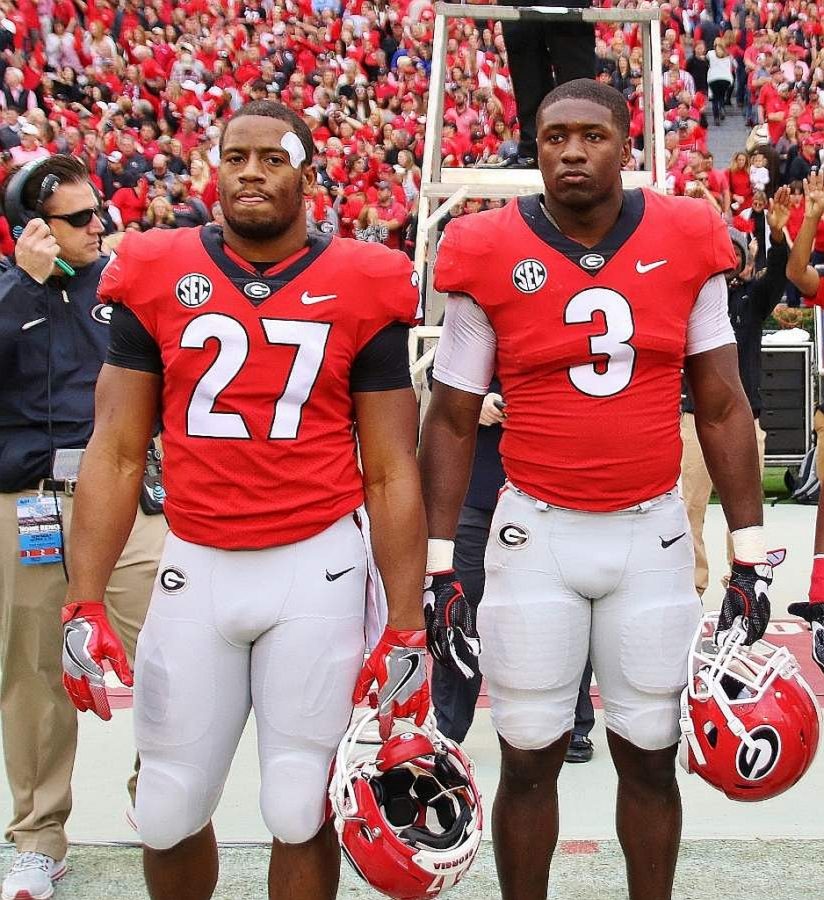 Nick Chubb (27) and Roquan Smith (3) - (Photo by Rob Saye)