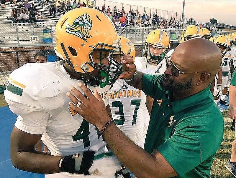 Channing Tindall (left) with Coach Mitch Moton (right) (Photo from Channing Tindall / Twitter)