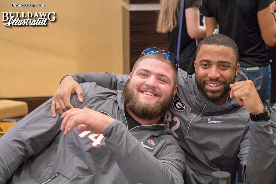 - Georgia offensive lineman Ben Cleveland (74) and wide receiver Michael Chigbu (82)