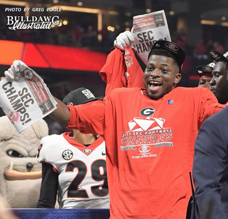 Lorenzo Carter celebrates  with the Georgia football celebrates it's 28-7 victory over rival Auburn in the 2017 SEC Championship to earn the conference crown and title.